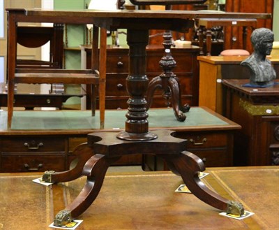 Lot 1252 - A Regency mahogany flip top table on turned legs