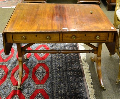 Lot 1253 - A George III mahogany and cross banded sofa table (a.f.)