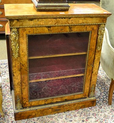 Lot 1255 - A Victorian walnut pier cabinet with gilt metal mounts