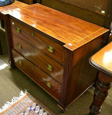 Lot 1261 - A 19th century cross banded mahogany chest of drawers, the three drawers flanked by fluted pillars