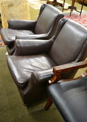 Lot 1269 - A pair of Victorian armchairs recovered in brown leather