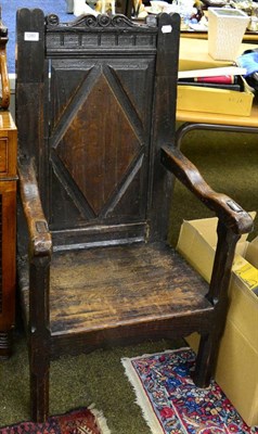 Lot 1280 - A joined oak armchair