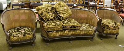 Lot 1281 - A French three piece bergere suite on lion paw supports