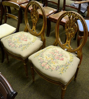 Lot 1283 - A pair of 19th century gilt dining chairs on stop fluted legs