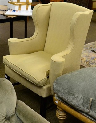 Lot 1290 - A Georgian style wingback armchair and another similar