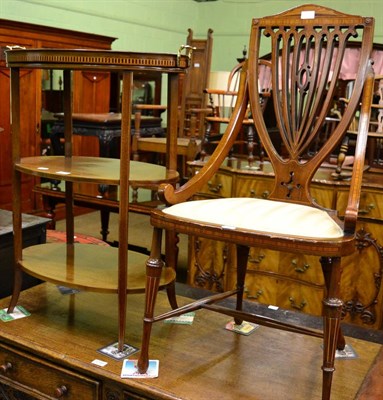 Lot 1298 - An Edwardian mahogany etagere of three tier oval form with stringing, the top with removable...