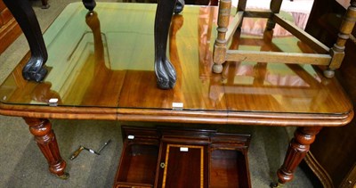 Lot 1311 - A mahogany table with one leaf, winder and glass top