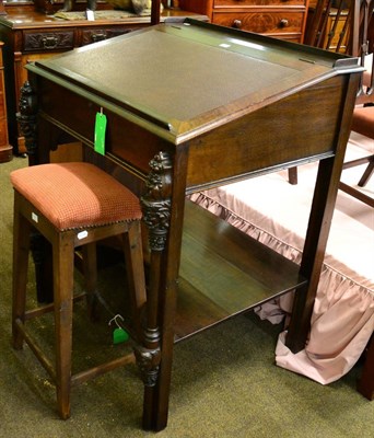 Lot 1321 - An ornate magistrates desk and a tall stool