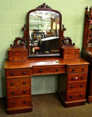 Lot 1331 - A Victorian mahogany dressing table with swing mirror back