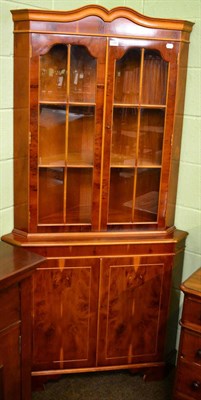 Lot 1332 - A reproduction yew wood corner cabinet