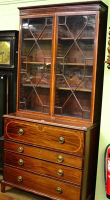 Lot 1345 - A cross banded mahogany secretaire bookcase