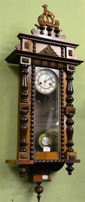 Lot 1349 - A regulated wall clock with decorative case