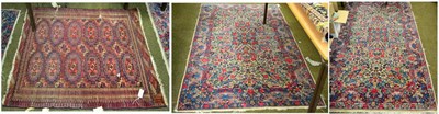 Lot 1352 - A pair of Kirman rugs, South East Iran, each with a cream field of floral design enclosed by...