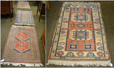 Lot 1354 - Two middle eastern rugs, one peach ground, one terracotta ground (2)