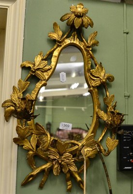 Lot 1369 - A foliate, gilt girandole mirror