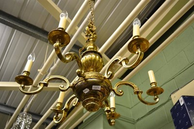 Lot 1371 - A brass six branch chandelier