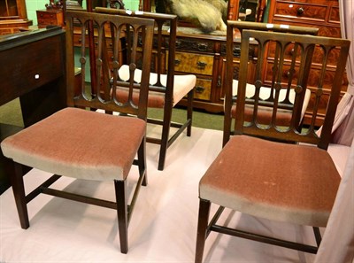 Lot 1377 - A set of four early 19th century mahogany dining chairs, pierced backs, overstuffed seats,...