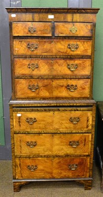 Lot 1380 - A 1920s walnut chest on chest of small proportions, the upper section with two short over three...