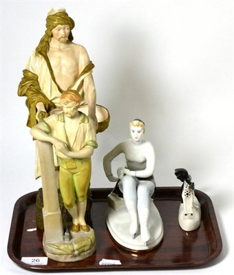 Lot 26 - Two Austrian pottery figures, together with two Russian figures