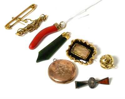 Lot 50 - A coral cornicello pendant, a nephrite pendant, a Masonic ball, a mourning brooch, a seed pearl...