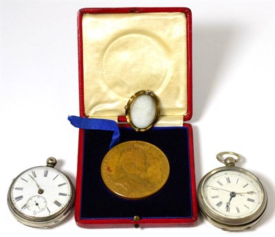 Lot 55 - A silver cased pocket watch and a 1902 medal etc