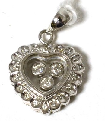 Lot 61 - An 18 carat white gold 'floating' diamond heart pendant