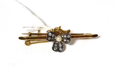 Lot 75 - A pearl and diamond shamrock brooch, with old cut diamond set leaves and a central pearl, to a bar