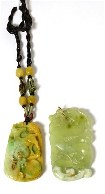 Lot 91 - A jade pendant and a bowenite pendant