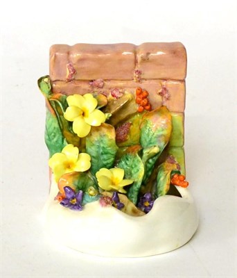 Lot 95 - A Royal Doulton floral bookend of naturalistic from, mark to base