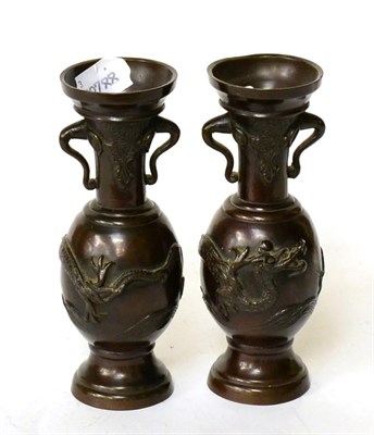 Lot 96 - A pair of Japanese Meiji Period bronze vases decorate with dragons (one a.f.)