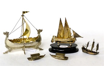 Lot 104 - A group of silver models of boats, comprising: a Norwegian example; a Maltese example on...