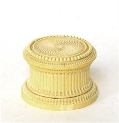 Lot 105 - An ivory box and cover, early 19th century, of circular form with engine turned decoration, 9cm...