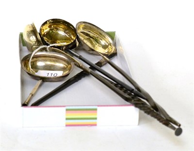 Lot 110 - A group of five George III ladles, with coin set bowls and twisted handles, all apparently...