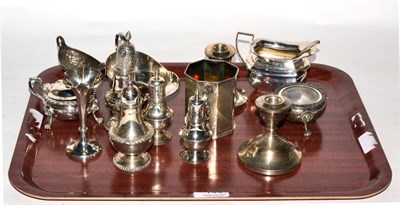 Lot 144 - A group of silver to include a Victorian octagonal mug; sauceboat; dwarf candlesticks; cream...