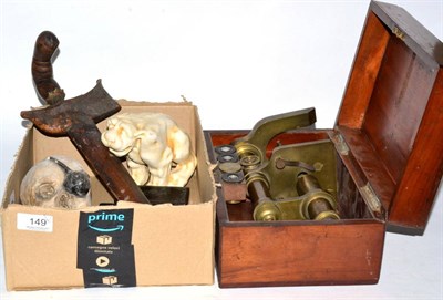 Lot 149 - A cased monocular microscope, a kriss, a plaster skull, a mythical beast and two snuff boxes