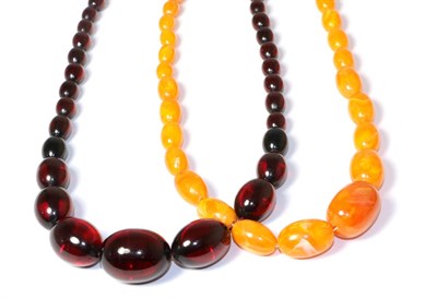 Lot 152 - A bakelite bead necklace and an orange bead necklace