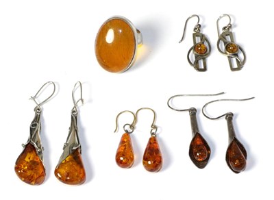 Lot 154 - Four pairs of amber earrings and amber ring