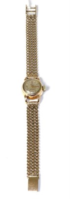 Lot 155 - A lady's Omega wristwatch, on a strap stamped '750'