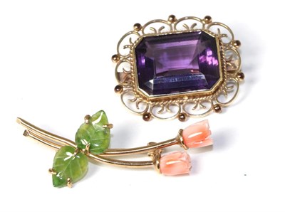 Lot 170 - A 9 carat gold amethyst brooch and a coral and nephrite flower brooch (2)