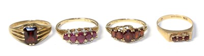 Lot 187 - A 9 carat gold ruby ring and three 9 carat gold garnet rings (4)