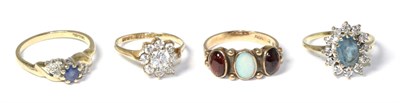 Lot 188 - A 9 carat gold opal and garnet ring and three 9 carat gold gem set rings (4)