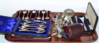 Lot 204 - Two cased sets of silver teaspoons; a cased set of butter knives; a group of assorted napkin rings