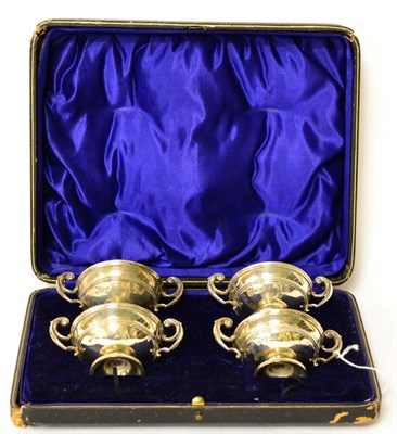 Lot 207 - A set of four silver twin-handled salts, in a fitted case