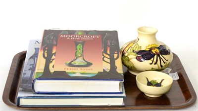 Lot 229 - Moorcroft pottery Columbine vase (a.f.) and dish, together with two books, Moorcroft a new dawn and