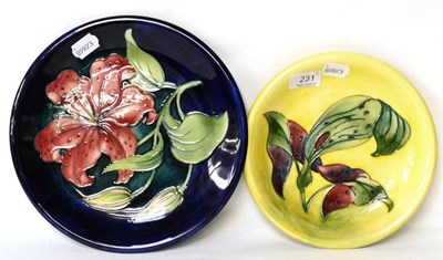 Lot 231 - Two Moorcroft pottery lily pattern plates (one with small chip to reverse)