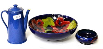 Lot 233 - A large Walter Moorcroft Hibiscus bowl (damaged), a William Moorcroft Powder Blue coffee pot...