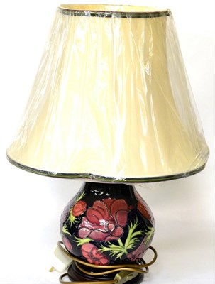 Lot 244 - A modern Moorcroft Anemone pattern table lamp with new Moorcroft shade