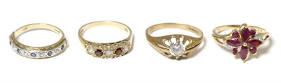 Lot 261 - A 9 carat gold ruby cluster ring and three 9 carat gold rings (4)