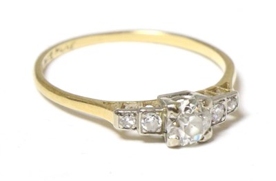 Lot 266 - A solitaire diamond ring with diamond set shoulders