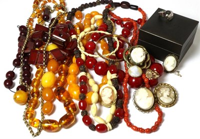 Lot 278 - A carved amber bead necklace (some beads cracked), imitation amber necklaces and beads and...